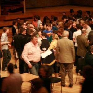 The Melee - conductor with trophy